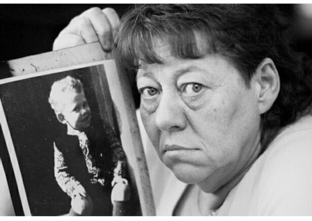 A photo of Martin Brown's mother holding his picture taken in 2018