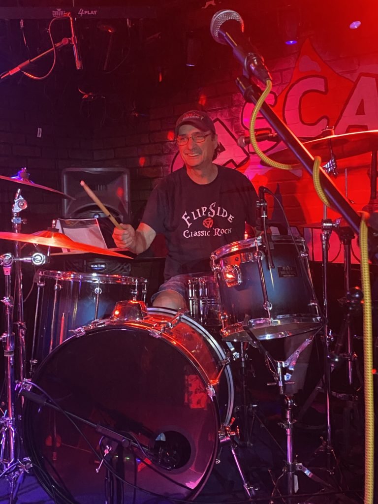 Tony Harris sitting behind a drum set